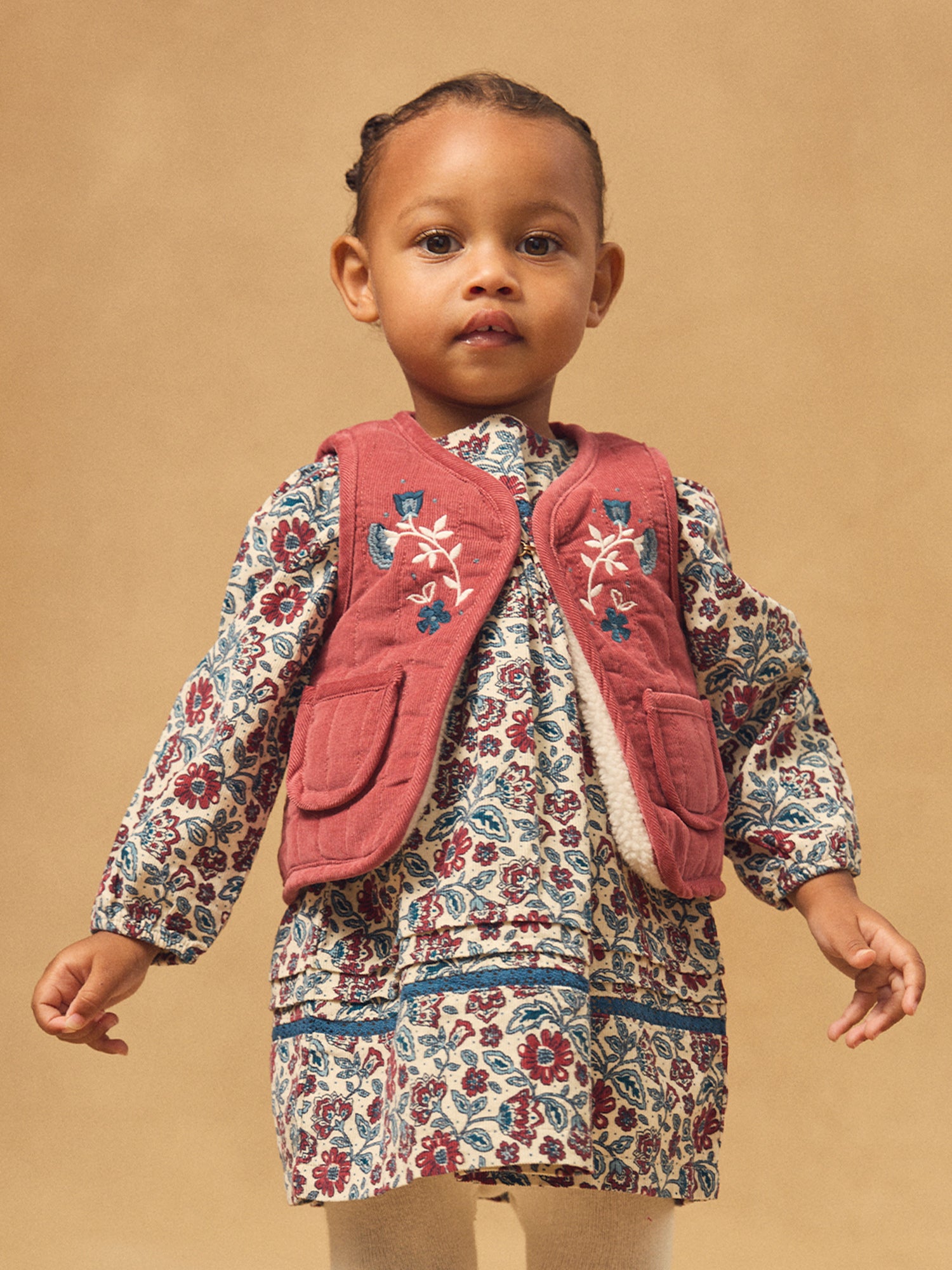 Cárdigan reversible rojo o crema para bebé niña