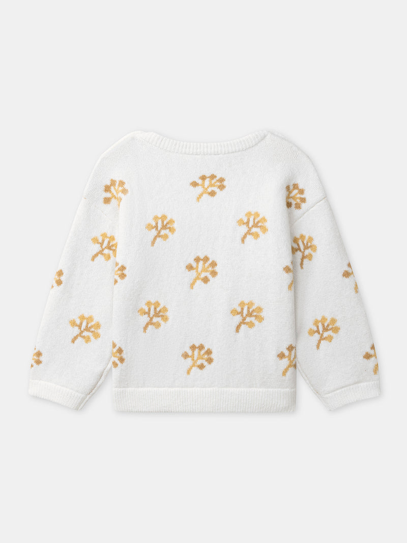 Suéter crema con patrón de flores amarillas para niña
