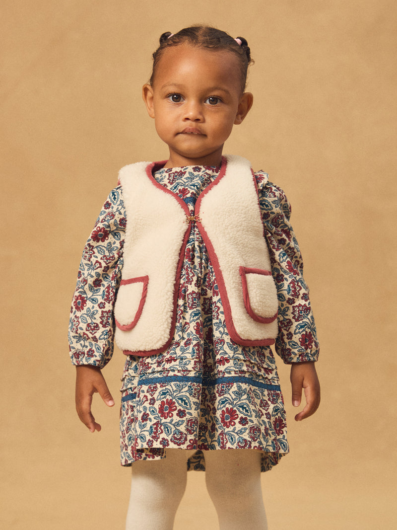 Cardigan sans manches réversible rouge ou écru Bébé Fille