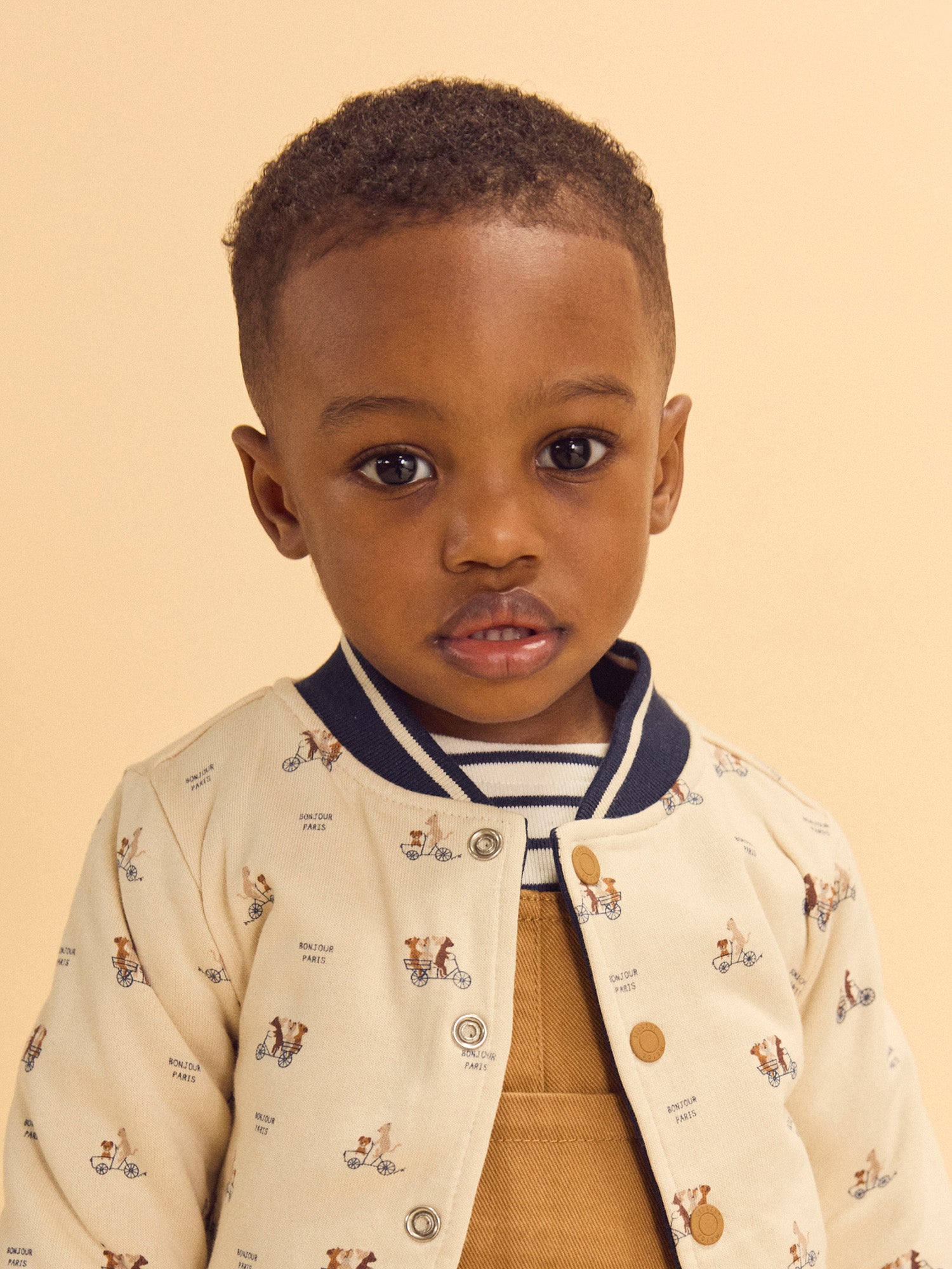 Teddy reversible azul marino o crema estampado de perros bebé niño