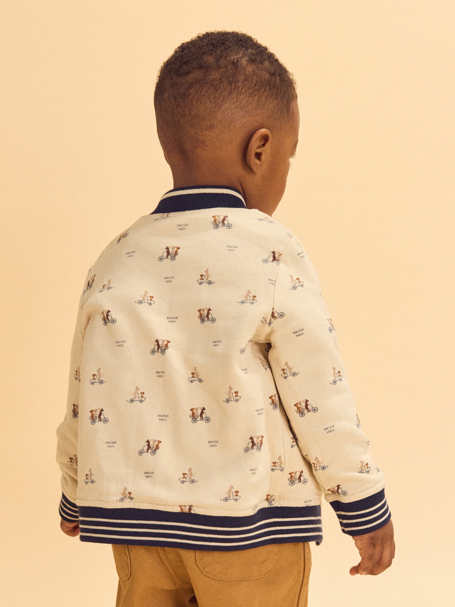 Teddy reversible azul marino o crema estampado de perros bebé niño