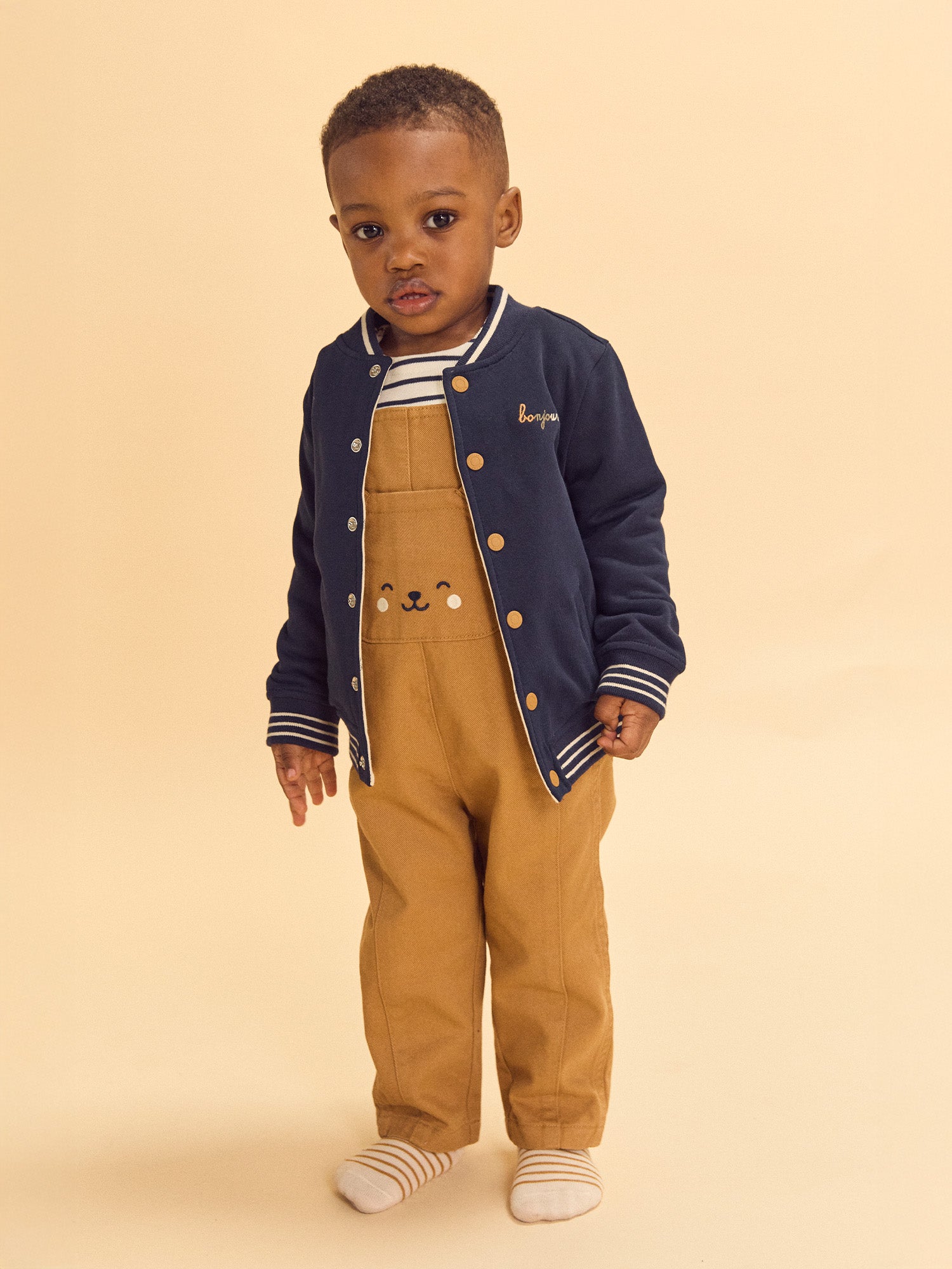 Teddy reversible azul marino o crema estampado de perros bebé niño
